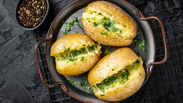 Why Piercing And Turning Matter When Microwaving Baked Potatoes